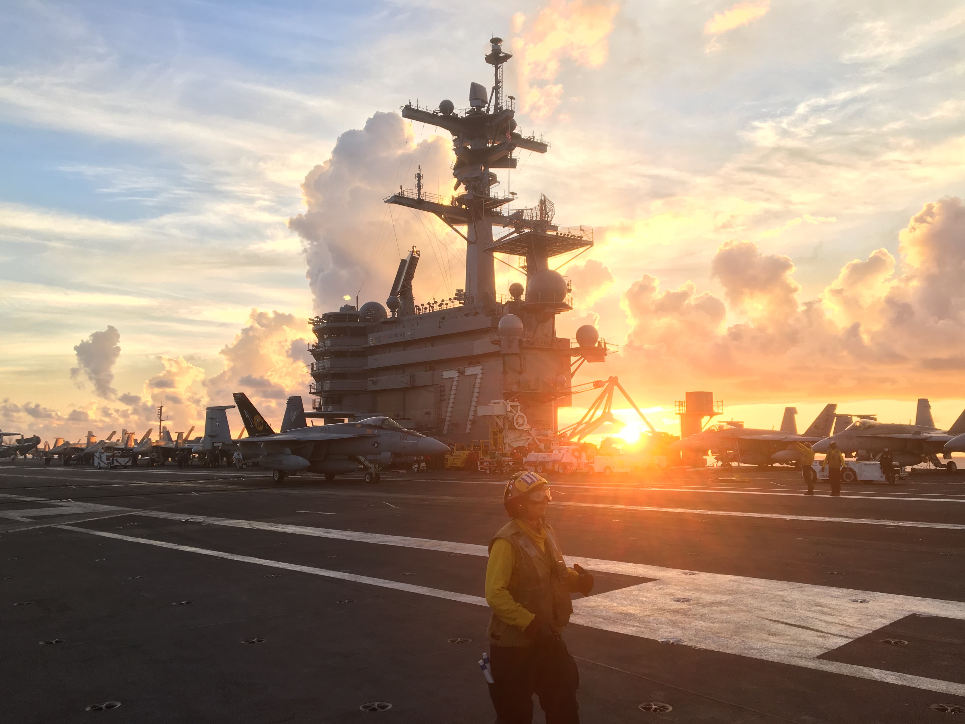 Aircraft carrier flight deck at sunset